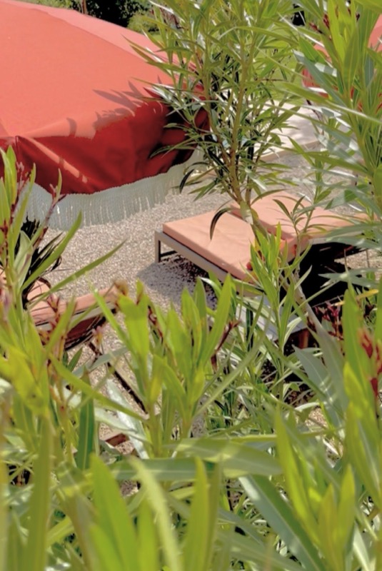 Estate buildings and sculpture in the gardens of Toile Blanche